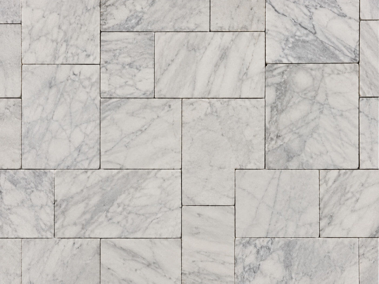 White marble pool deck pavers with subtle veining