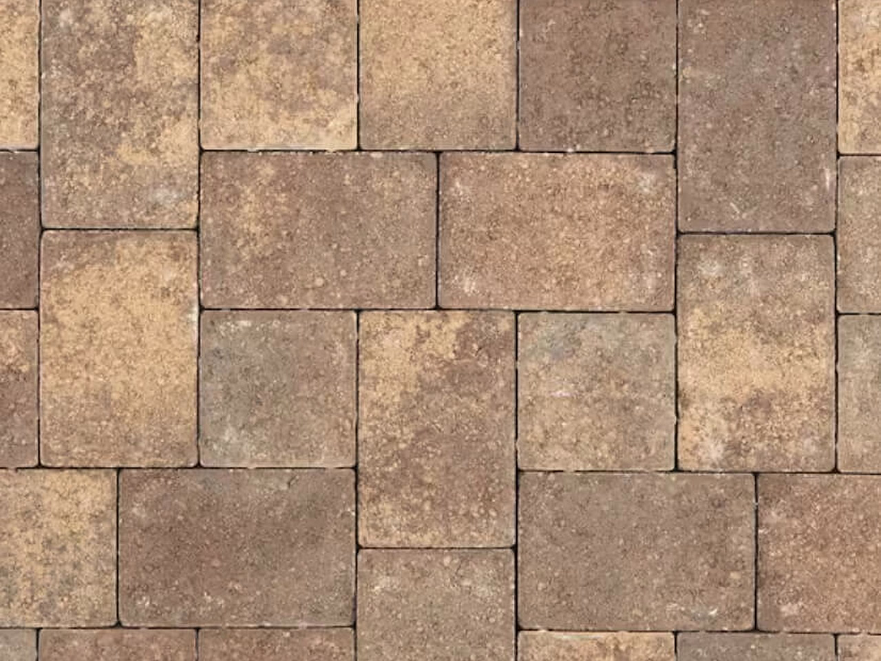 Parkland walkway detail of tumbled brick pavers blending tan, brown, and ocher in a modular pattern